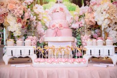 Candy bar and wedding cake. Table with sweets, buffet with cupcakes, candies, dessert. Royalty Free Stock Image Candy bar and wedding cake. Table with sweets, buffet with cupcakes, candies, dessert. Royalty Free Stock Image