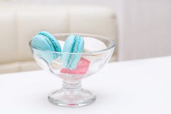 Candy Macaroons Lies In A Glass Vase For Sweets On A White Table Royalty Free Stock Images Candy Macaroons Lies In A Glass Vase For Sweets On A White Table Royalty Free Stock Images
