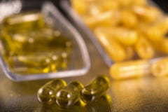 Cannabis extraction capsules infused with shatter and CBD oil stock images Cannabis extraction capsules infused with shatter and CBD oil stock images