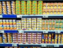 Canned seafood sold in a grocery. Different canned seafood sold in a grocery stock photos Canned seafood sold in a grocery. Different canned seafood sold in a grocery stock photos