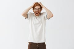 Cannot hold negative emotions inside anymore fed up of pressure. Portrait of med and insane screaming redhead man with royalty free stock photo Cannot hold negative emotions inside anymore fed up of pressure. Portrait of med and insane screaming redhead man with royalty free stock photo