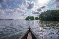 Canoe riding towards Mangrove forest in Munroe Island royalty free stock image Canoe riding towards Mangrove forest in Munroe Island royalty free stock image