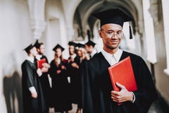 Cap. Campus. Guy. Mantle. Cheerful. Celebration royalty free stock images Cap. Campus. Guy. Mantle. Cheerful. Celebration royalty free stock images