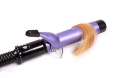 Capelli biondi e ferro di arricciatura elettrico immagini stock Capelli biondi e ferro di arricciatura elettrico immagini stock