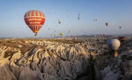 CAPPADOCIA, TURKEY - MAY 04, 2018: Hot air balloon flying over r stock image CAPPADOCIA, TURKEY - MAY 04, 2018: Hot air balloon flying over r stock image