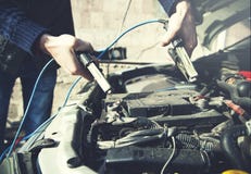 Car battery man hand royalty free stock photos Car battery man hand royalty free stock photos