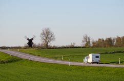 Car with caravan in a green landscape Royalty Free Stock Image Car with caravan in a green landscape Royalty Free Stock Image