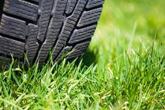 Car Tyre On The Green Grass Stock Images Car Tyre On The Green Grass Stock Images