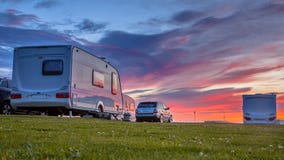 Caravans and cars sunset Royalty Free Stock Photography Caravans and cars sunset Royalty Free Stock Photography