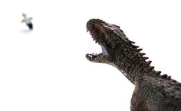 Carcharodontosaurus chassant un peuple courant Image stock Carcharodontosaurus chassant un peuple courant Image stock