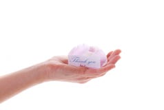 Card with gratitude and a flower in her hand Stock Image Card with gratitude and a flower in her hand Stock Image