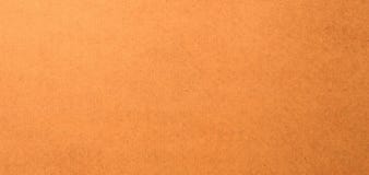 Cardboard surface brown mixed with orange. Paper box for background.