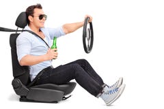 Careless young man drinking and driving royalty free stock photo Careless young man drinking and driving royalty free stock photo