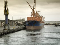 Cargo ship docked at at the port of Walvis Bay, Namibia Stock Photography Cargo ship docked at at the port of Walvis Bay, Namibia Stock Photography