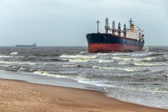 A cargo ship has been thrown out on the Baltic Sea coast by storm Royalty Free Stock Photography A cargo ship has been thrown out on the Baltic Sea coast by storm Royalty Free Stock Photography