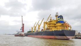 Cargo ship moored in port along the river stock images Cargo ship moored in port along the river stock images
