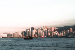 Cargo ships crossing the Victoria Harbor in Hong Kong China during sunset stock image Cargo ships crossing the Victoria Harbor in Hong Kong China during sunset stock image