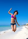 Caribbean Woman Jumping On The Tropical Beach Stock Images
