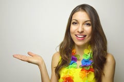 Carnival concept. Beautiful cheerful young woman ready for carnival party showing your product or text on gray background. stock photography Carnival concept. Beautiful cheerful young woman ready for carnival party showing your product or text on gray background. stock photography