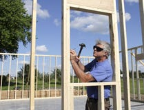 Carpenter Building a House stock photo Carpenter Building a House stock photo