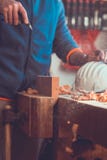 An carpenter use a air pump to clean the wood piece, air nozzles gun in hand , dust in air royalty free stock image An carpenter use a air pump to clean the wood piece, air nozzles gun in hand , dust in air royalty free stock image