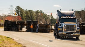 Carrboro NC, /US-March 10 2017:Logging Truck Overturns On Highway Stock Photos Carrboro NC, /US-March 10 2017:Logging Truck Overturns On Highway Stock Photos