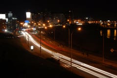 Cars By The Promenade At Night With Motion Blur Stock Images