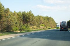 Cars on the track in the summer day near Kazan in Tatarstan in Russia stock photo Cars on the track in the summer day near Kazan in Tatarstan in Russia stock photo