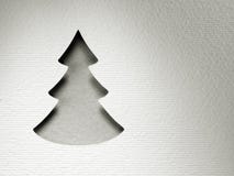 Carta monocromatica d'annata di progettazione di taglio della carta dell'albero di Natale fotografia stock Carta monocromatica d'annata di progettazione di taglio della carta dell'albero di Natale fotografia stock