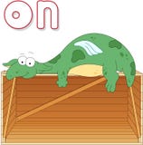 Cartoon Dragon Lies On A Box. English Grammar In Pictures Stock Photography Cartoon Dragon Lies On A Box. English Grammar In Pictures Stock Photography