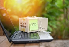 Cash on delivery shipping laptop ecommerce delivery shopping online and order concept / selling online shopping packing stock photography Cash on delivery shipping laptop ecommerce delivery shopping online and order concept / selling online shopping packing stock photography