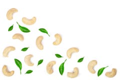 Cashew nuts with leaves isolated on white background with copy space for your text. top view. Flat lay pattern stock photo Cashew nuts with leaves isolated on white background with copy space for your text. top view. Flat lay pattern stock photo