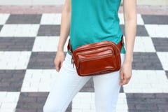 Casual weared women with big leather weist bag on black and whit royalty free stock image Casual weared women with big leather weist bag on black and whit royalty free stock image