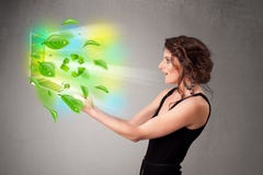 Casual woman holding notebook with recycle and environmental symbols royalty free stock photography Casual woman holding notebook with recycle and environmental symbols royalty free stock photography