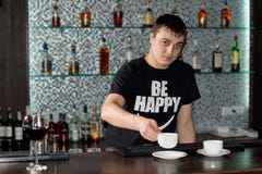 Caucasian barman serving coffee at the bar royalty free stock photos Caucasian barman serving coffee at the bar royalty free stock photos