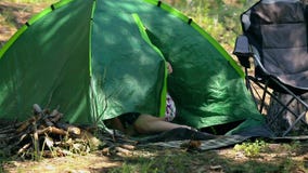 Caucasian dad and son assembling tent on holiday outdoors stock video Caucasian dad and son assembling tent on holiday outdoors stock video