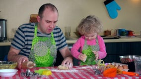 Caucasian father and daughter having fun rolling out cookie dough in kitchen stock video Caucasian father and daughter having fun rolling out cookie dough in kitchen stock video