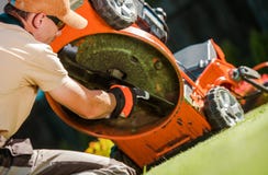 Checking Lawn Mower Blades royalty free stock photos Checking Lawn Mower Blades royalty free stock photos