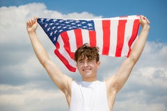 Caucasian male on a beach holding an American flag stock image Caucasian male on a beach holding an American flag stock image