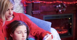Caucasian mother reading a book story to her beautiful little daughter stock footage Caucasian mother reading a book story to her beautiful little daughter stock footage