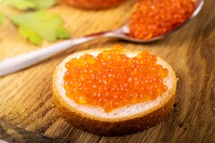 Caviar snacks - red fish roe on the bread royalty free stock photos Caviar snacks - red fish roe on the bread royalty free stock photos