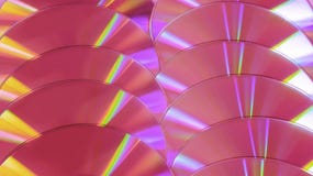 CD DVD schijf glanst de kleurrijke compacte regenboog als achtergrond plastic roze viooltje stock afbeeldingen CD DVD schijf glanst de kleurrijke compacte regenboog als achtergrond plastic roze viooltje stock afbeeldingen