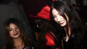 Celebrating Halloween in nightclub in costume
