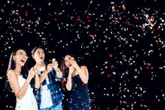 Celebration party group of asian young people holding confetti h stock photo Celebration party group of asian young people holding confetti h stock photo