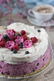 Celebratory cake with berries and a cup of aromatic coffee. Vintage napkin, spoon and pink flowers royalty free stock image Celebratory cake with berries and a cup of aromatic coffee. Vintage napkin, spoon and pink flowers royalty free stock image