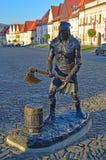 Woodcutter statue and Central square with the Church of St. Aegidius and town hall Bardejov, Slovakia royalty free stock images Woodcutter statue and Central square with the Church of St. Aegidius and town hall Bardejov, Slovakia royalty free stock images