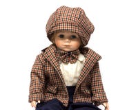 Ceramic porcelain handmade vintage doll of brunette boy with curly hair. stock photo Ceramic porcelain handmade vintage doll of brunette boy with curly hair. stock photo