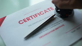 Certificate document approved, hand stamping seal on official paper, validation