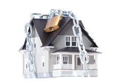Chain with lock around the house royalty free stock photo Chain with lock around the house royalty free stock photo