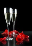 Champagne glasses and petals
